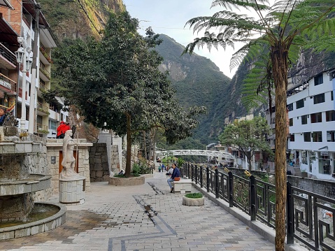 View Of Andes Mountain, Building Exterior, People Walking, Standing And More During The Day At Aguas Calientes City In Peru South America