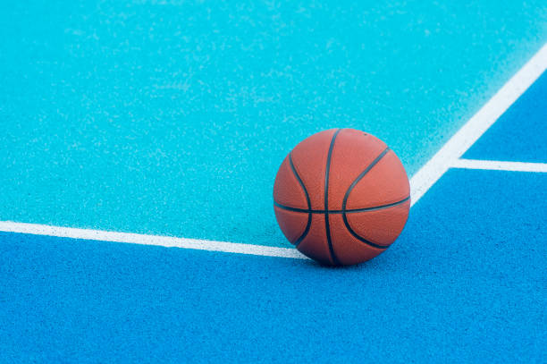 istock Orange Basketball ball on the blue surface 1175552784