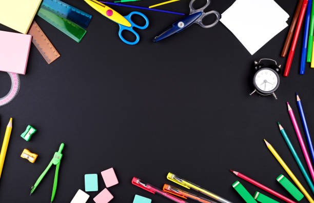 istock school supplies: multicolored wooden pencils, notebook, paper stickers, paper clips, pencil sharpener 1175553576