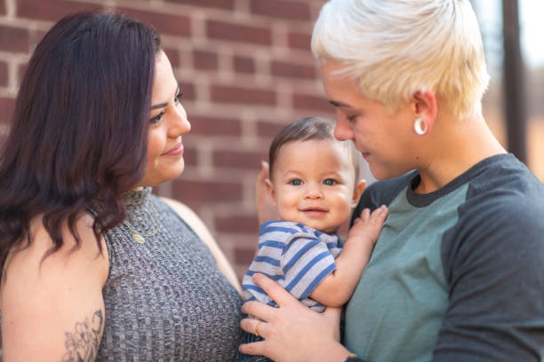 istock Lesbian couple with baby 1175554137