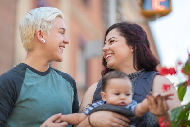 istock Happy lesbian couple with baby 1175554196