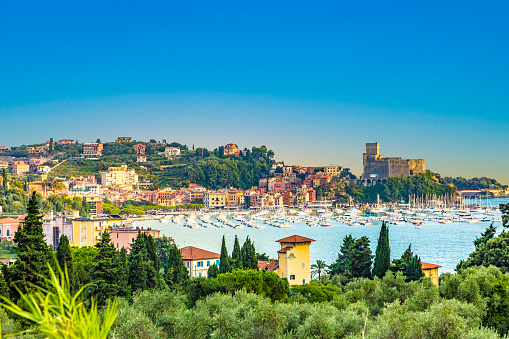 view of the boats in the Bay of Poets from the path leading to the castle at Lerici, Italy in summertime