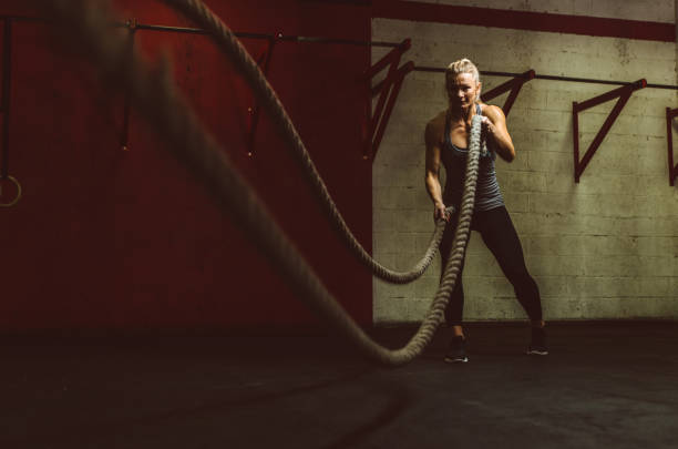 istock Beautiful young woman training at the gym 1175556718