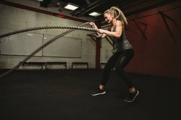 istock Beautiful young woman training at the gym 1175557193