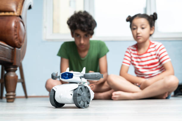 istock Brother And Sister Playing With Robotics 1175557360