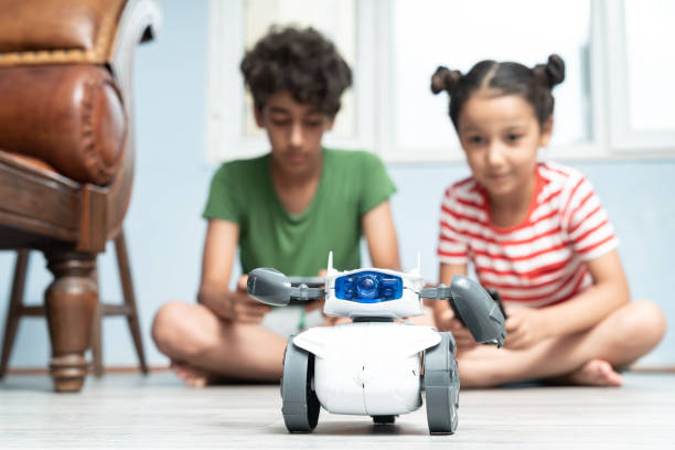 istock Brother And Sister Playing With Robotics 1175557409