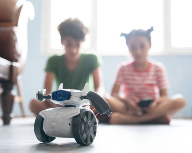 istock Brother And Sister Playing With Robotics 1175557473