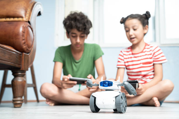 istock Brother And Sister Playing With Robotics 1175557605