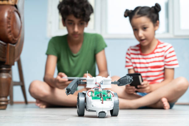 istock Brother And Sister Playing With Robotics 1175558529