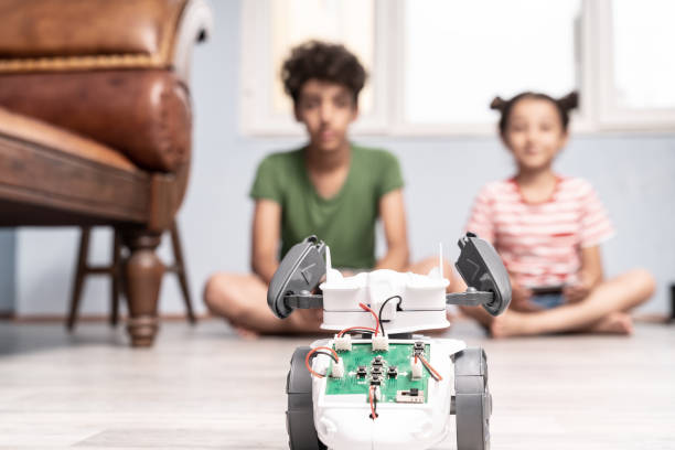 istock Brother And Sister Playing With Robotics 1175558610