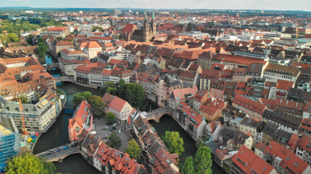 istock Nuremberg, Germany. Drone aerial view from a vantage viewpoint along city river 1175558728