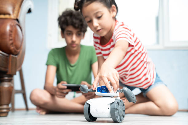 istock Brother And Sister Playing With Robotics 1175558818