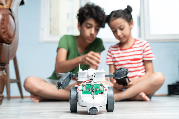 istock Brother And Sister Playing With Robotics 1175558855