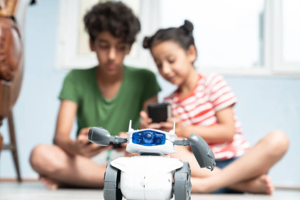 Brother And Sister Playing With Robotics
