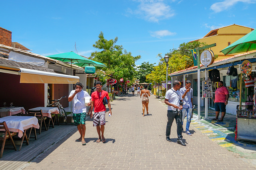 Famous main walking street for tourists to buy souvenirs, with shops,bar and restaurant in Praia Do Forte, State of Bahia, Brazil,