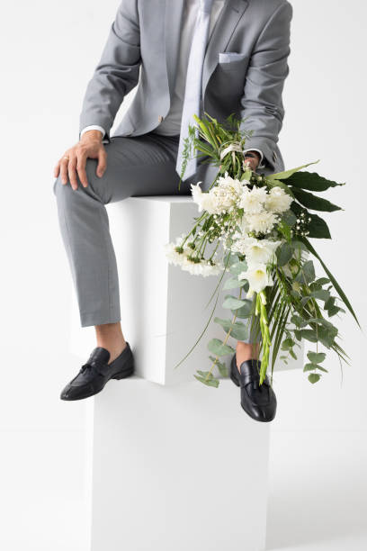istock Groom Holding Wedding Bouquet 1175565981