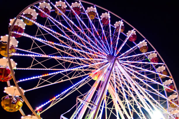 istock A colourful chairoplane carousel at a fun fair at night 1175566502