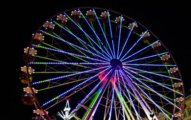 istock A colourful chairoplane carousel at a fun fair at night 1175567051
