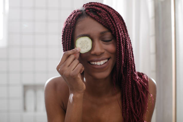 istock Woman Using Cucumber as Eye Mask 1175568844