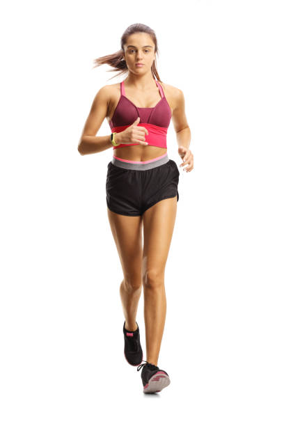 istock Young female athlete running towards camera 1175568918