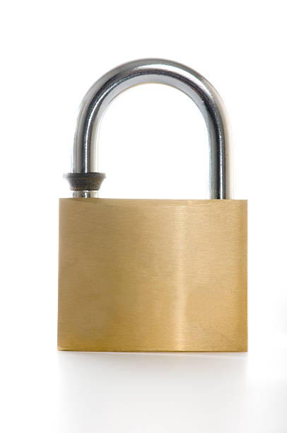 istock Metal lock with gold color isolated on white 117557009