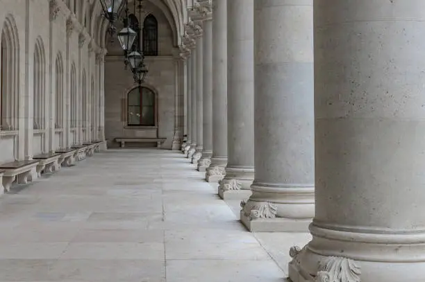 Architectural details of the building. Row of white columns.