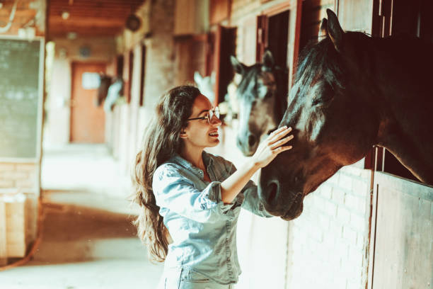 istock Woman And Horse 1175572476