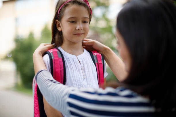 istock Mother taking daughter to school 1175573692