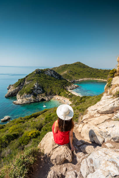 ポート ティモニ, コルフギリシャ - sea swimming greece women ストックフォトと画像