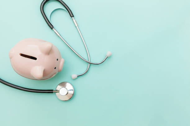 medicine doctor equipment stethoscope or phonendoscope and piggy bank isolated on trendy pastel blue background - stethoscope blue healthcare and medicine occupation imagens e fotografias de stock