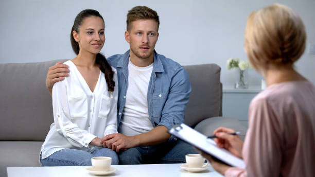 istock Happy couple visiting social worker before adoption, preparation child custody 1175583405