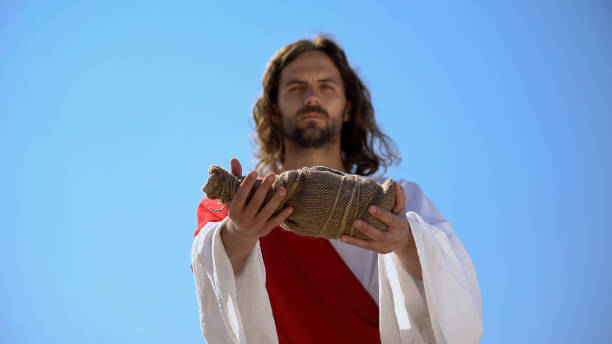 saint man offering bottle of water, biblical history to give drink to thirsty - jesus christ human hand god consoling imagens e fotografias de stock