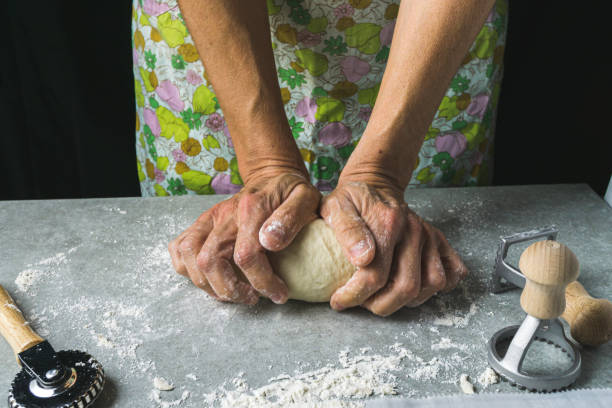 istock A female cook kneading dough 1175584793