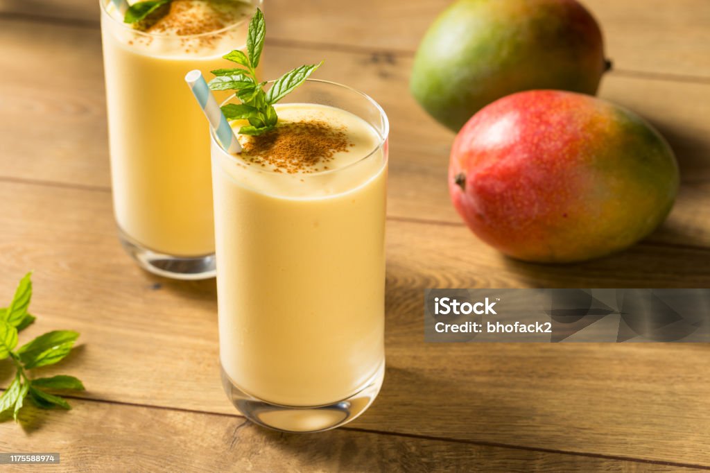 Homemade Sweet Indian Mango Lassi Homemade Sweet Indian Mango Lassi Smoothie with Mint Mango Fruit Stock Photo