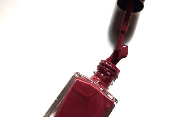 istock Red​ color​ nail​ polisher​ bottle​ 1175590837