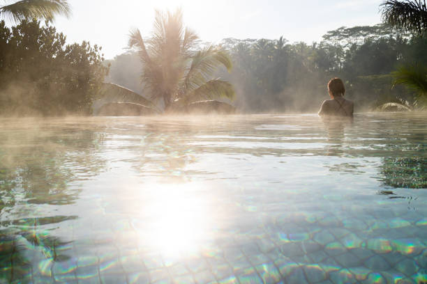 istock A young woman relaxing in an infinity pool 1175598199