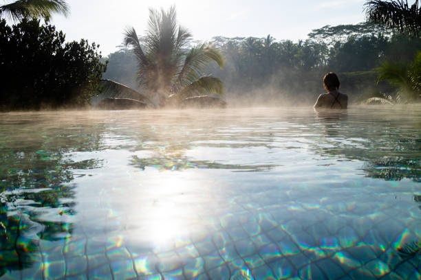 istock A young woman relaxing in an infinity pool 1175598203