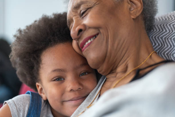 istock Grandmother hugs granddaughter lovingly 1175599779