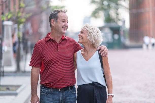 istock Senior couple walking through city 1175600685