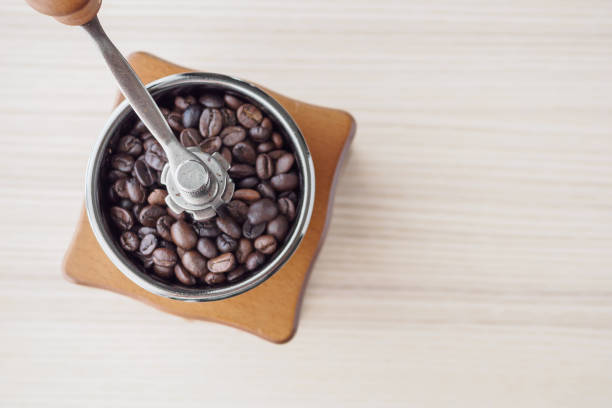 istock Vintage manual coffee grinder with roasted coffee beans 1175606281