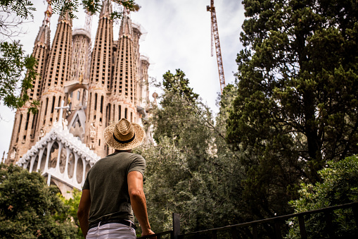 Male traveler visiting Barcelona.He is enjoying the view to Sagrada Familia