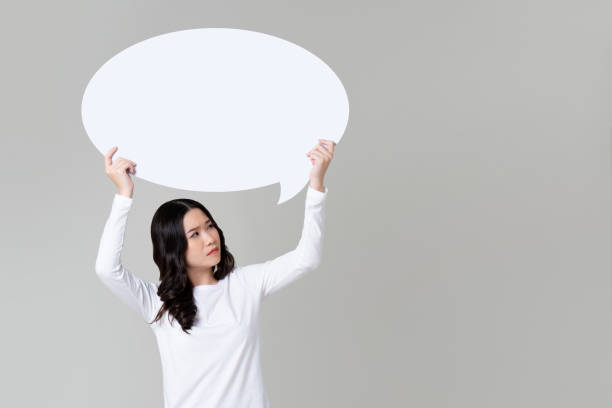 istock Doubted Asian woman raising speech bubble 1175607807