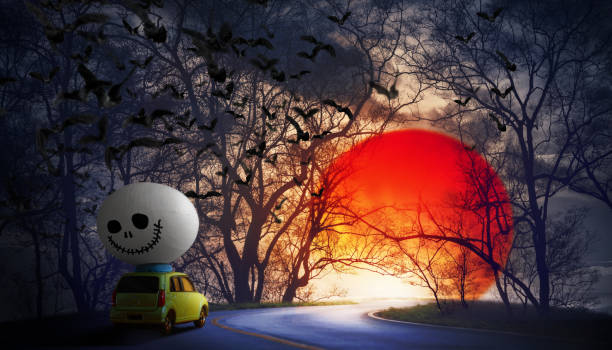 istock Vintage car with spooky Halloween egg  running through scary tree tunnel,full moon dark night. 1175608124