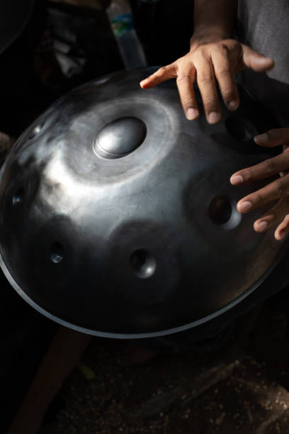 istock Hands on hang drum,music in the garden. 1175608206