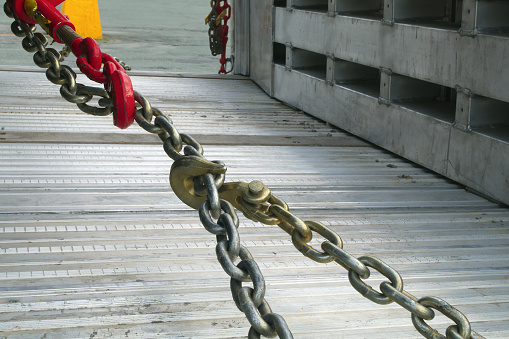 Section of a metal chain link border.