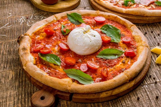 Pizza with burrata cheese stock photo