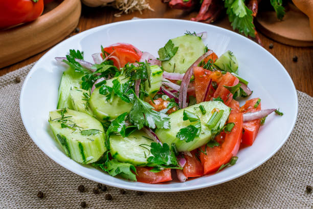istock Vegetable salad with tomatoes and cucumbers 1175611412