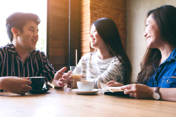 istock people enjoyed talking, reading and drinking coffee together in cafe 1175613307