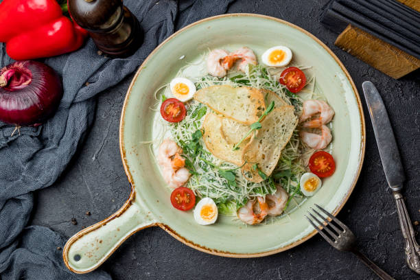 istock salad caesar with shrimps 1175613329