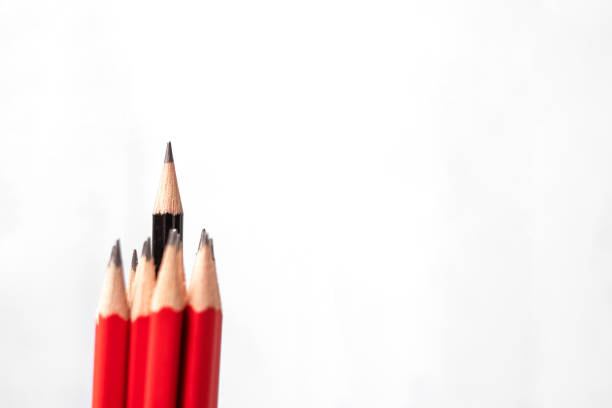 istock Black pencil different from crowd of red pencils. Unique Leader, strategy, independence, think different, business and success concept 1175615056